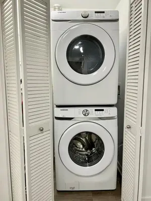 a washing machine and a dryer in a closet at Silver Lake 1 Bedroom Condo Suite with Balcony and Parking in Los Angeles