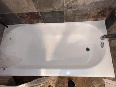 a white bath tub sitting in a bathroom at STADIUM LUXURY - CONDO for 4 STEPS AWAY FROM SOFI in Inglewood