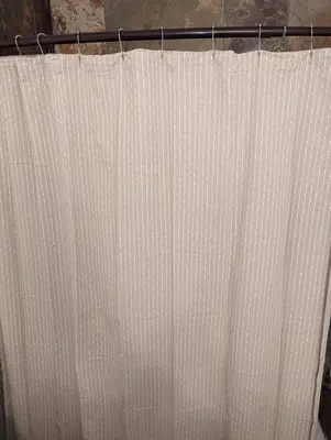 a white shower curtain hanging from a shower rod at STADIUM LUXURY - CONDO for 4 STEPS AWAY FROM SOFI in Inglewood