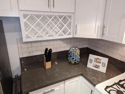 a kitchen with white cabinets and a counter top at STADIUM LUXURY - CONDO for 4 STEPS AWAY FROM SOFI in Inglewood