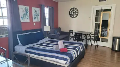 a bedroom with a bed with a stuffed animal on it at BH Adj, studio spacious BH in Los Angeles