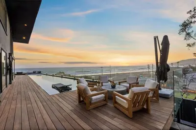 a deck with a view of the ocean at Surfside Malibu by Stay Awhile Villas in Malibu