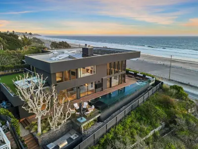 an aerial view of a house with the beach at Surfside Malibu by Stay Awhile Villas in Malibu