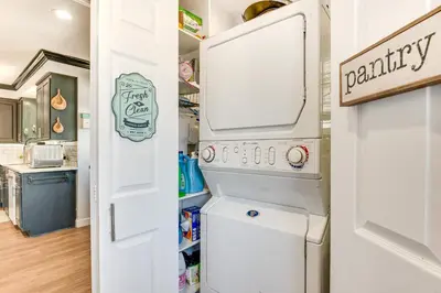 a white washer and dryer in a kitchen at Relax Fireside Hacienda Heights Gem with Patio! in Hacienda Heights