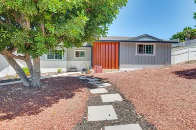 a yard with a tree and a house at Relax Fireside Hacienda Heights Gem with Patio! in Hacienda Heights