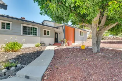 a house with a tree in front of it at Relax Fireside Hacienda Heights Gem with Patio! in Hacienda Heights