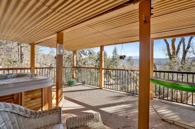 a wooden pergola with a sink and a hammock on a deck at Big Bear 7th Heaven #714 in Fawnskin
