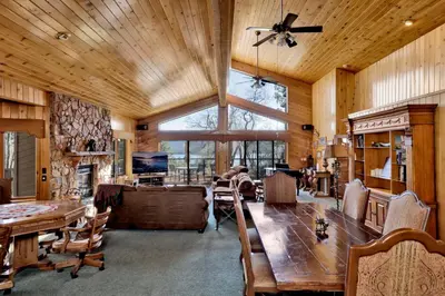 a dining room with a table and a large window at Big Bear 7th Heaven #714 in Fawnskin
