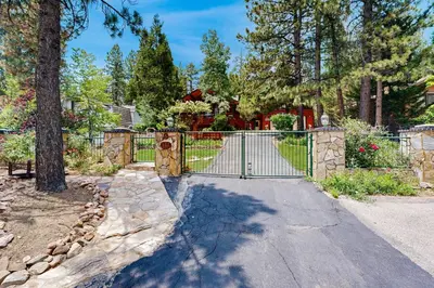 a driveway with a gate in a yard at Rooster's Den #710 in Big Bear Lake