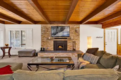 a living room with a couch and a fireplace at Summit Hideaway #445 in Big Bear Lake