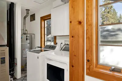 a kitchen with a white sink and a window at Summit Hideaway #445 in Big Bear Lake