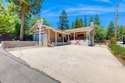 a house with a driveway in front of it at Lazy Bear Cabin #554 in Big Bear Lake
