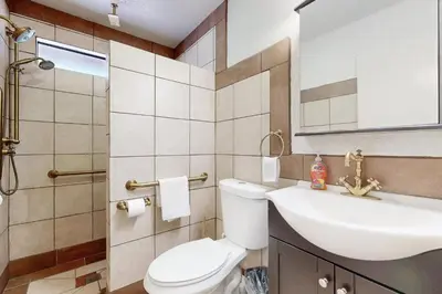 a bathroom with a white toilet and a sink at Lazy Bear Cabin #554 in Big Bear Lake