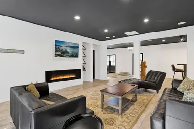 a living room with two couches and a fireplace at Hillside Hideaway #603 in Big Bear Lake