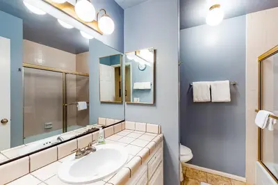 a bathroom with a sink and a mirror at Rosie's Hideaway #331 in Big Bear Lake