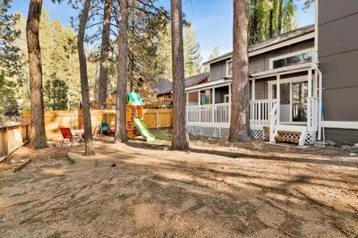 a house with a yard with a playground at Moose-in' Around in Big Bear Lake