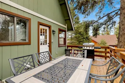 a picnic table on the front porch of a house at Quiet Cabin #564 in Big Bear Lake