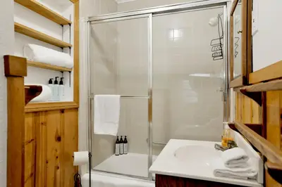 a bathroom with a shower and a sink at Quiet Cabin #564 in Big Bear Lake
