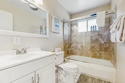 a bathroom with a sink and a toilet and a shower at Meadow-Front Metcalf Bay Gem #542 in Big Bear Lake