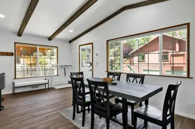a dining room with a table and chairs at The Fox Den #2568 in Big Bear City
