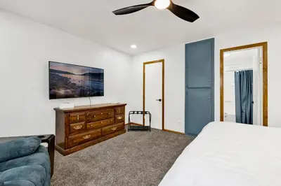 a bedroom with a bed and a ceiling fan at The Fox Den #2568 in Big Bear City