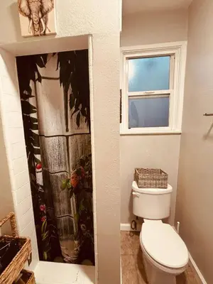 a bathroom with a toilet and a window at Cozy Studio Studio City Unit 6 in Los Angeles