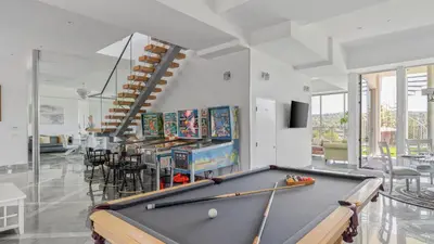 a billiard room with a pool table in it at Luxe 8000 sqft w 2 Pools Sauna Putting Green Game Room Alta Vista Estate in Los Angeles