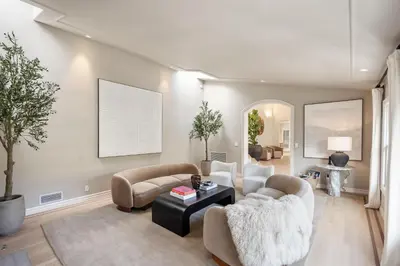 a living room with two couches and a table at Villa Avra by Stay Awhile Villas in Los Angeles