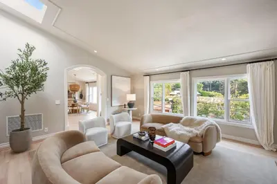 a living room with two couches and a table at Villa Avra by Stay Awhile Villas in Los Angeles