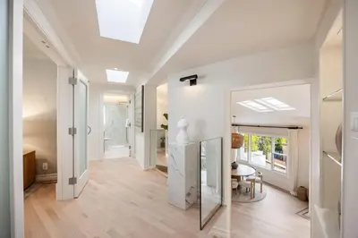 a hallway of a home with a table and a mirror at Villa Avra by Stay Awhile Villas in Los Angeles