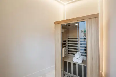 a room with a glass door with towels in it at Villa Avra by Stay Awhile Villas in Los Angeles