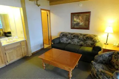 a living room with a couch and a coffee table at Getaways at Lagonita Lodge in Big Bear Lake