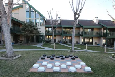a table with bowls on it in front of a building at Getaways at Lagonita Lodge in Big Bear Lake