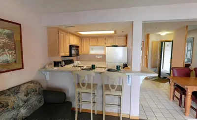 a kitchen with a large island in a living room at Getaways at Lagonita Lodge in Big Bear Lake