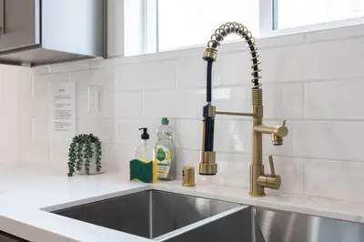 a kitchen sink with a kitchen faucet at Sunset Chateau Hollywood in Los Angeles