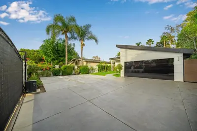 a large driveway with a garage in a house at Fulton Villa in Garnsey