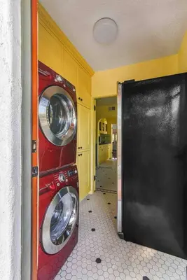 a washer and dryer in a room with a door at Welcome to The Spanish Hideaway! in Los Angeles
