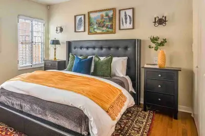a bedroom with a large bed and a window at Welcome to The Spanish Hideaway! in Los Angeles