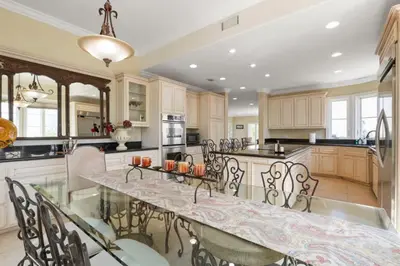 a large kitchen with a large table with chairs at City View Rancho Palos Verdes Home in Rancho Palos Verdes