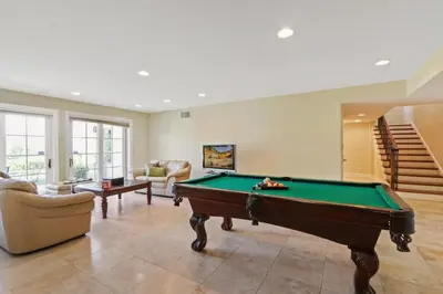 a living room with a pool table in it at City View Rancho Palos Verdes Home in Rancho Palos Verdes