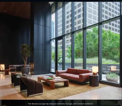 a lobby with couches and tables and large windows at Sky High at Beaudry 2 Bed Apt WITH FREE PARKING in Los Angeles