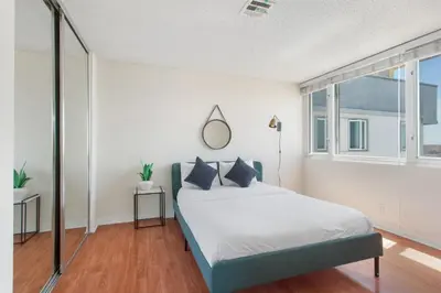 a bedroom with a bed and a large window at Top Floor Marina Escape 3BR Penthouse Ocean View in Los Angeles