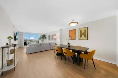 a dining room and living room with a table and chairs at Breezy & Beautiful - 3BR Marina del Rey Getaway in Los Angeles