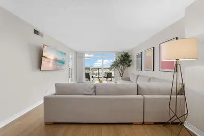 a living room with a couch and a window at Breezy & Beautiful - 3BR Marina del Rey Getaway in Los Angeles