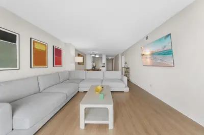 a living room with a white couch and a table at Breezy & Beautiful - 3BR Marina del Rey Getaway in Los Angeles