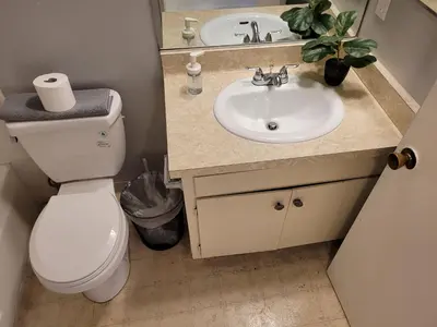 a bathroom with a toilet and a sink at Beverly Hills Nest in Los Angeles
