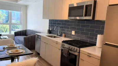 a kitchen with a stove and a microwave at Luxury Walk of Fame Studio in Los Angeles