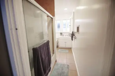 a bathroom with a walk in shower and a sink at Private Room in East Hollywood in Los Angeles