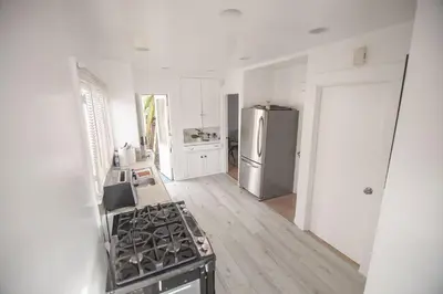 a kitchen with a stove and a refrigerator at Private Room in East Hollywood in Los Angeles