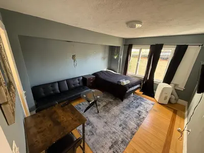 a living room with a couch and a bed at Private Room in East Hollywood in Los Angeles